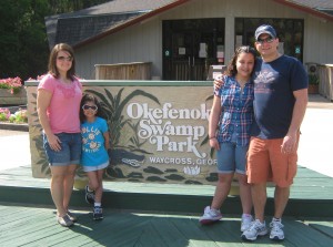In front of the Okefenokee sign